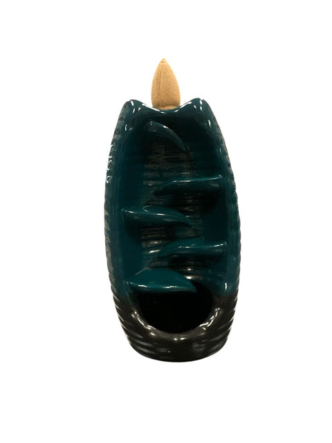 Teal ceramic incense burner with a wooden top on a white background