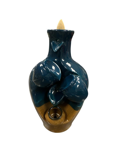 Ceramic incense burner with blue and brown design on a white background