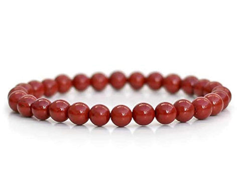 Red beaded bracelet on a white background