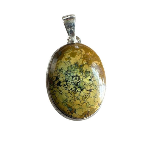 Oval-shaped pendant with a green and black speckled stone on a white background