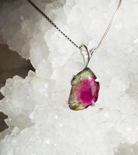 Crystal pendant necklace on a crystal background