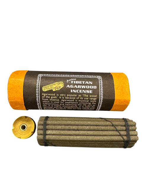 Tibetan Agarwood Incense with packaging on a white background